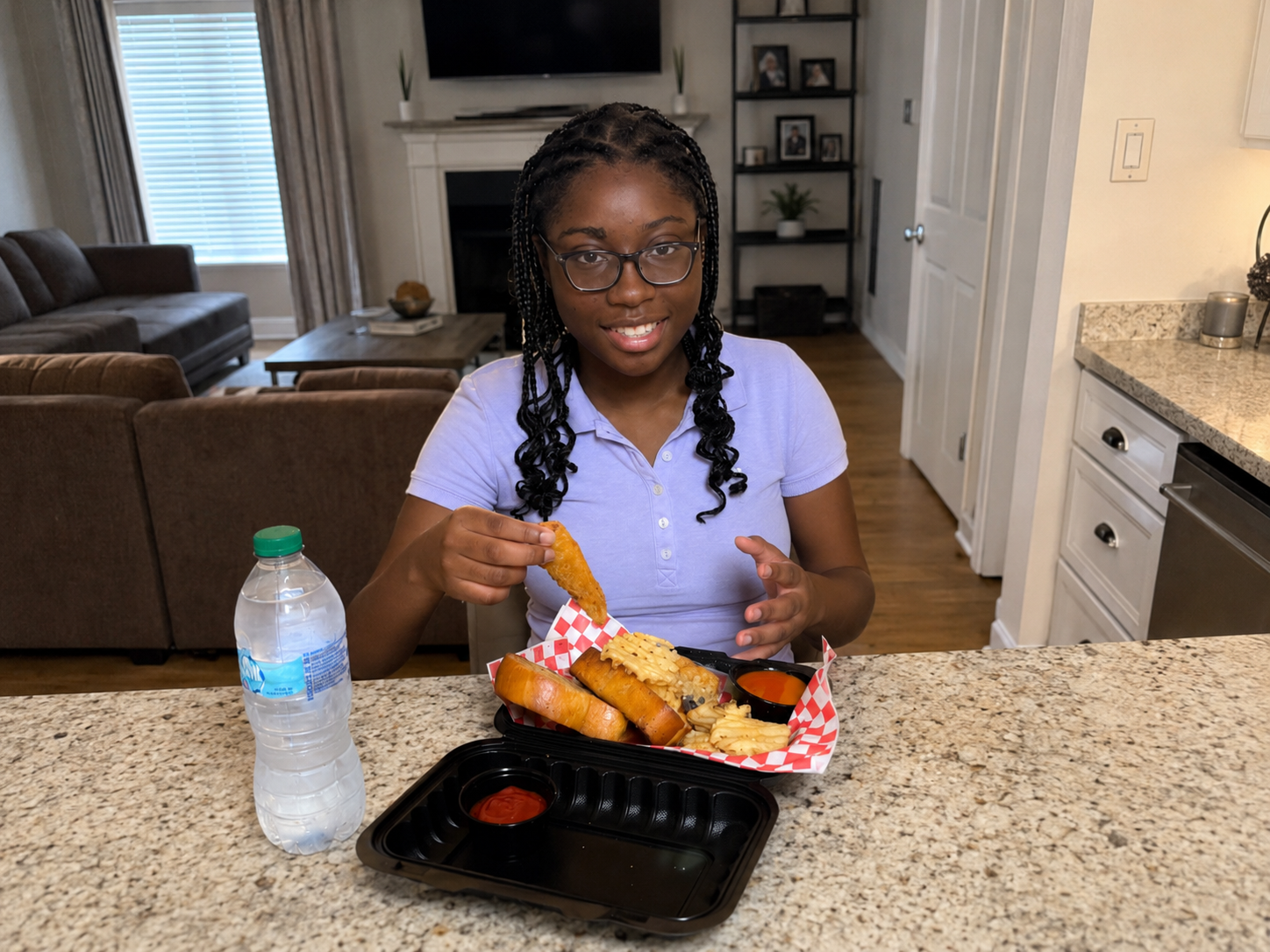 Customer holding a tender with combo meal, toast, fries, and water